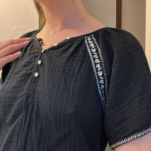 Floral embroidery, lightweight black flutter sleeve top